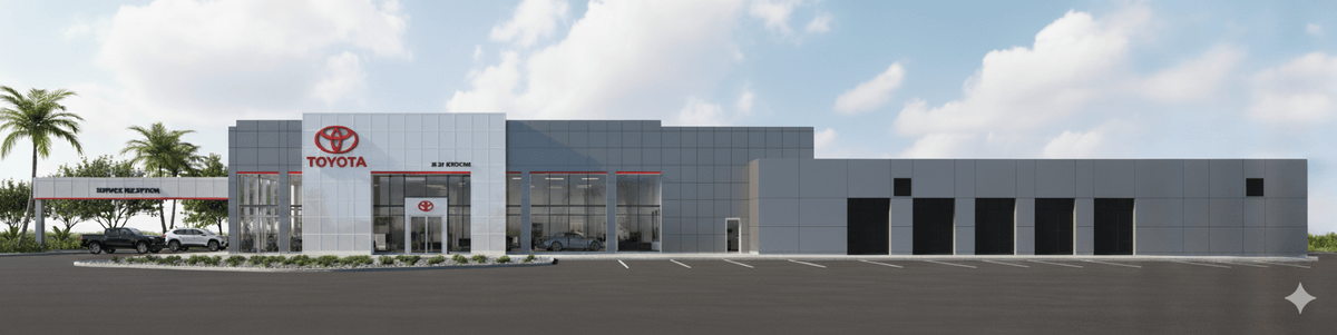 Representación arquitectónica digital de un concesionario Toyota moderno de fachada gris con franjas rojas. Al centro, una torre con el logo de Toyota y un área de exhibición acristalada donde se aprecian vehículos. A la izquierda, un dosel de recepción de servicio con vehículos estacionados y palmeras; a la derecha, una nave con varios portones oscuros de bahías de servicio. Al frente, un estacionamiento pavimentado con líneas demarcadas bajo un cielo azul con nubes.